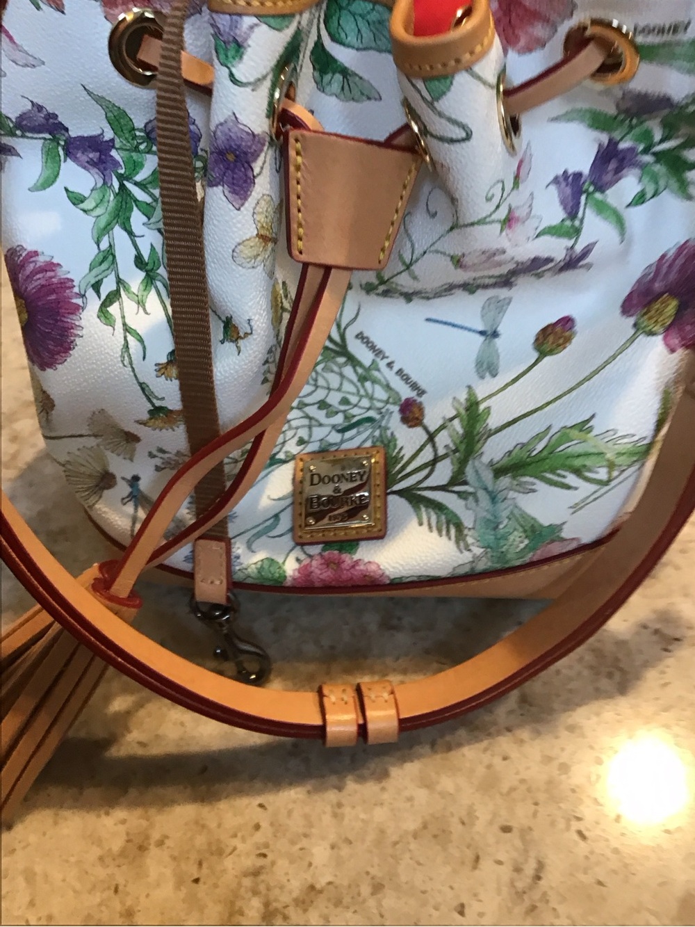 Dooney & Bourke White Floral Drawstring Tassel Bucket Bag with Tan Trim - Picture 3 of 8